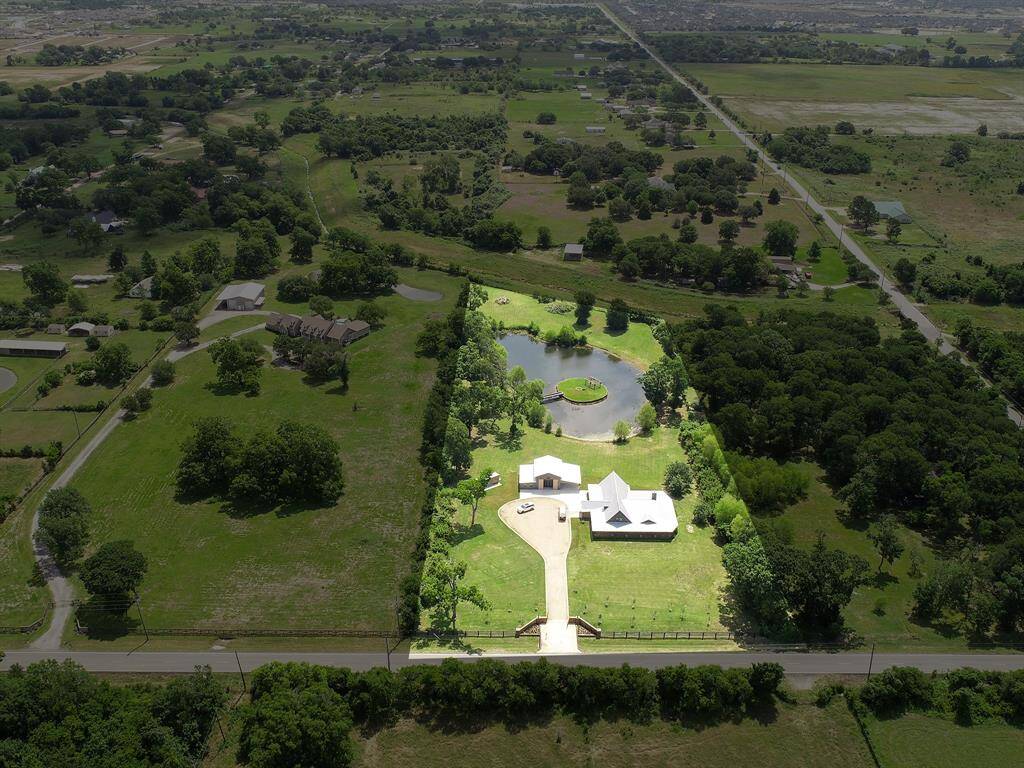 This birds eye views offers another view of the Pond and provides a glimpse of Bessie’s Creek that is at the back of the property.  Notice how the property is framed in mature trees that not only provide natural beauty, but also offer a huge degree of privacy.