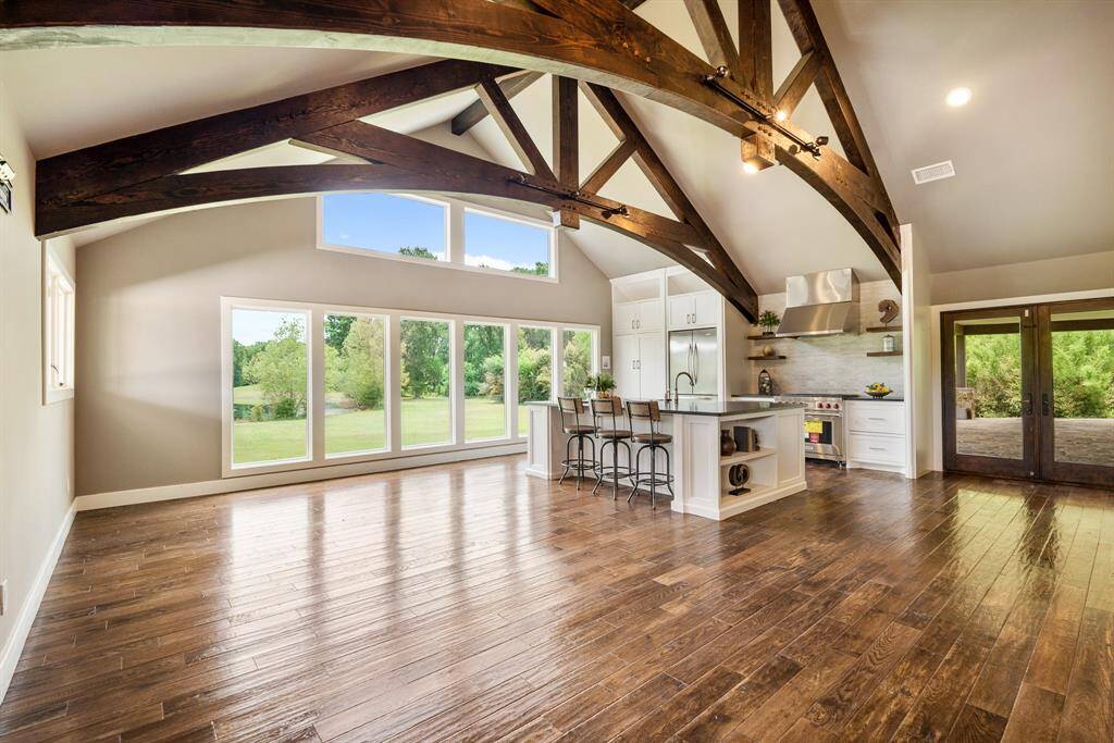 You won’t find a Kitchen as dramatic as this in any price range!  First noticed is the grand size of the room that measures an impressive 21x16 and is complemented by a raised ceiling with a pair of spectacularly designed open beam arched trusses.