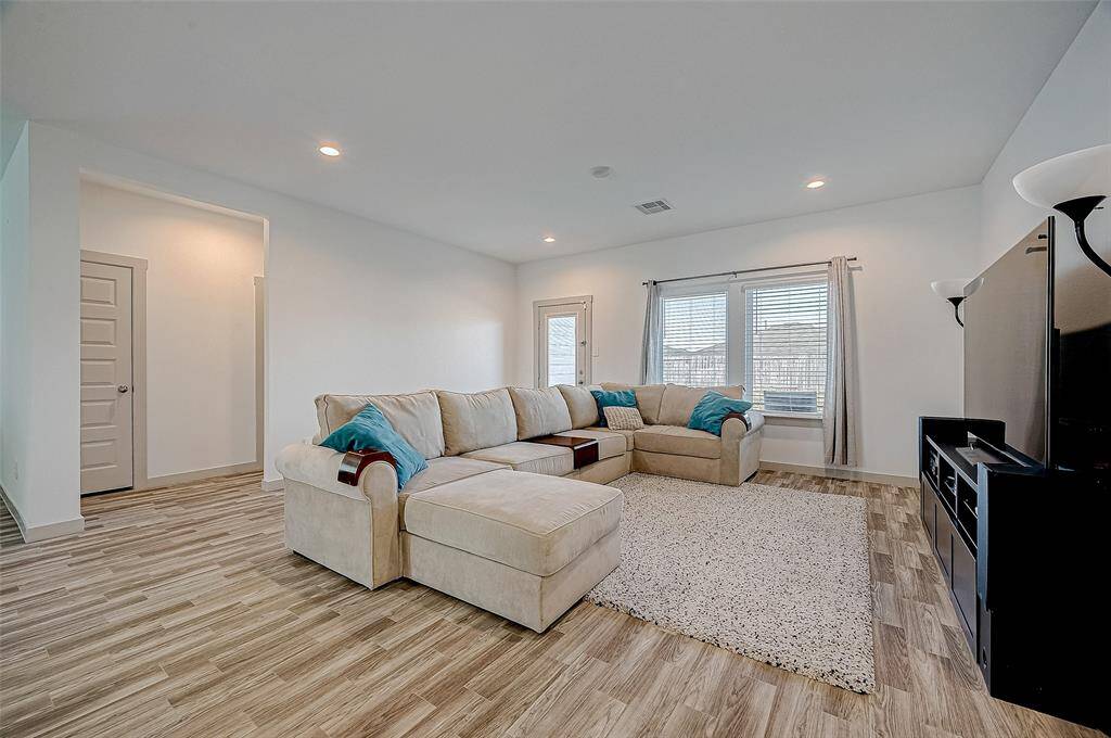 The spacious living room offers acomfortable and inviting space forrelaxation.