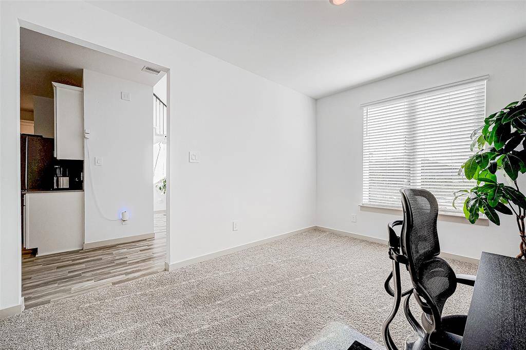A large window lets in plenty ofnatural light, and the open doorwayprovides easy access to the kitchenand main living areas.