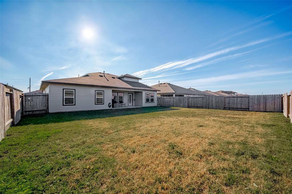 The covered patio adds a shadedretreat, while the fully fencedperimeter ensures privacy foroutdoor activities.
