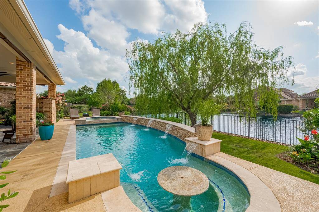 Heated pool spa, cool deck, water features.