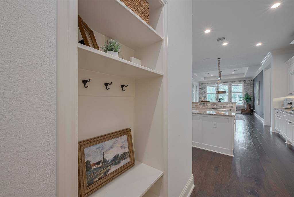 Off the garage entry, handbag and backpack storage area for keys, sunglasses.