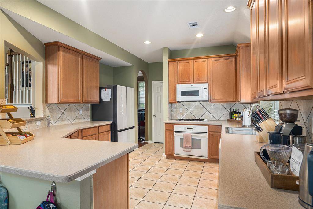 Beautiful Laundry Room with a window facing the frontyard.