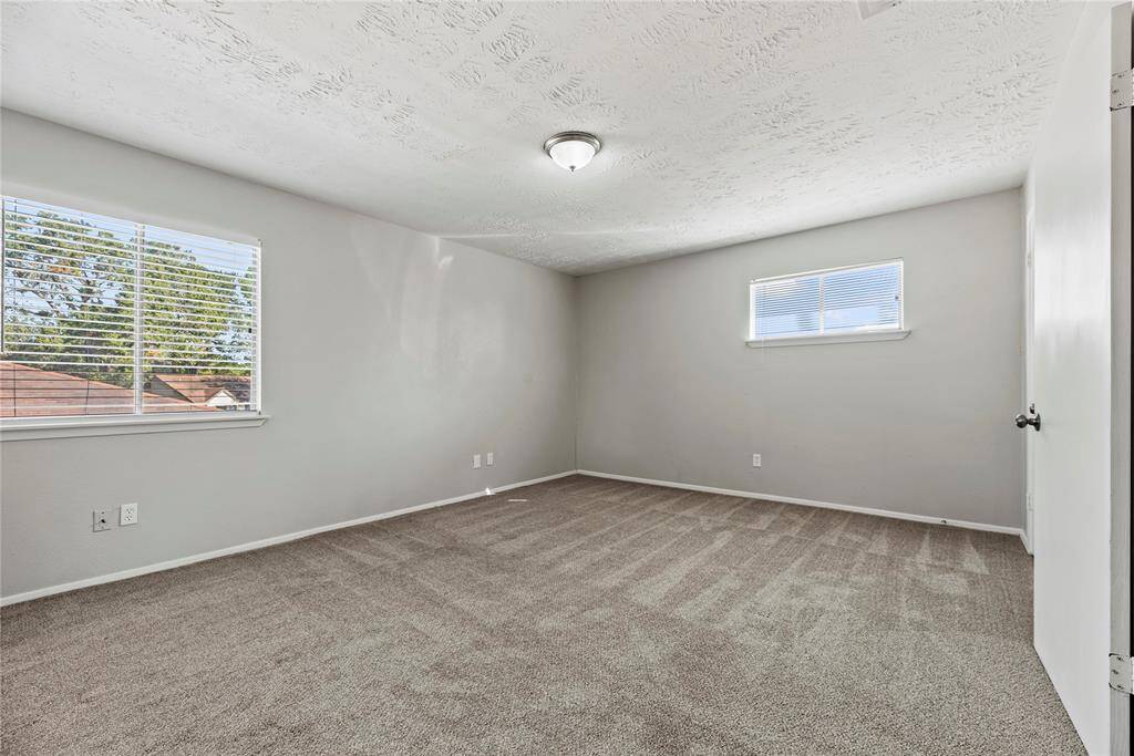 Large windows let in beautiful natural light to create a warm, comfortable space to relax and unwind.