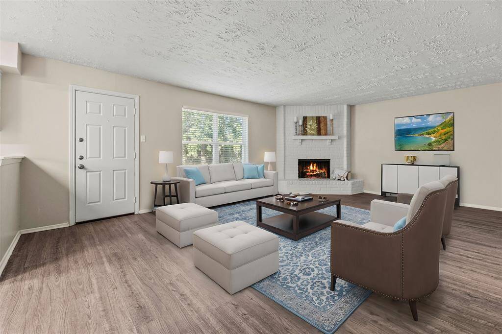 Step into the heart of your home, the family room, with a comfortable and inviting feel. The inviting center fireplace becomes a focal point that anchors the room and invites people to gather and linger, making it a cherished feature of the living area.