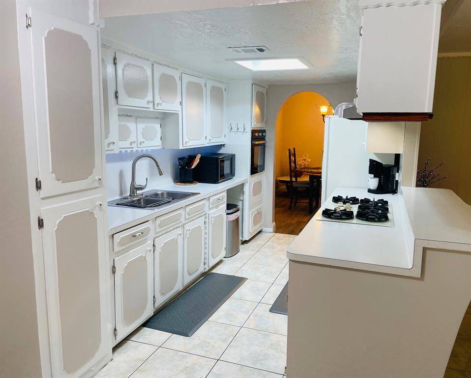 Galley Kitchen opens to family room