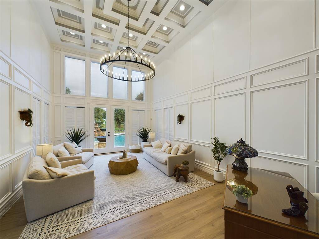 Floor to Ceiling Windows and Stunning Coffered Ceiling in the Living Room