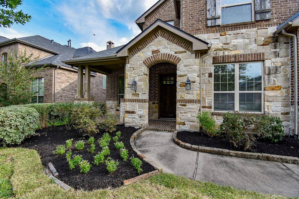 Welcome guests in style with a charming covered front patio that sets the tone for warmth and hospitality. Gracefully designed, the arched entryway adds architectural elegance and timeless appeal, creating a grand yet inviting first impression. The sheltered space offers a perfect spot to relax and enjoy the outdoors, rain or shine, while the arched details provide a classic touch that enhances the home's curb appeal.
