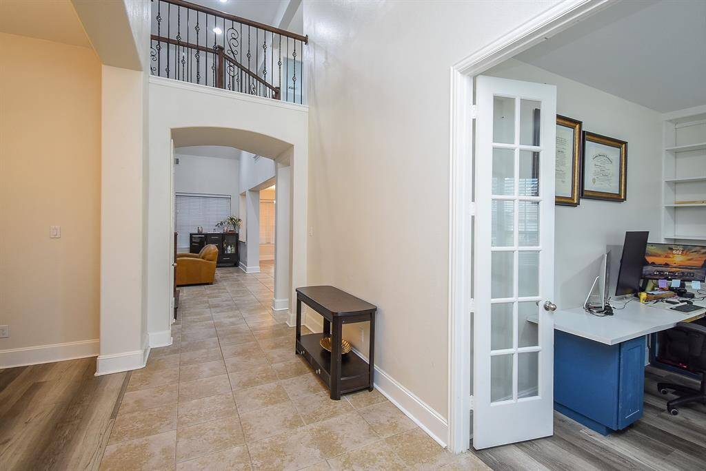 Towering ceilings and expansive open space create an immediate sense of grandeur, highlighting the fine finishes and architectural details.
