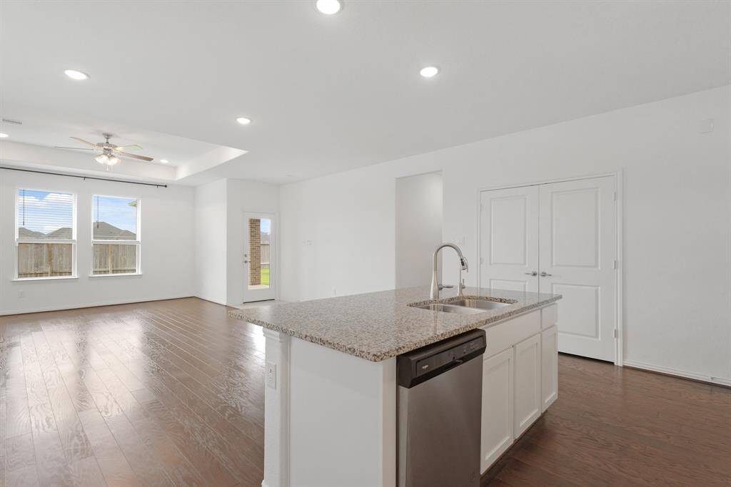 Experience a Kitchen island that overlooks the Family Room, offering easy interaction and a great space for gatherings.