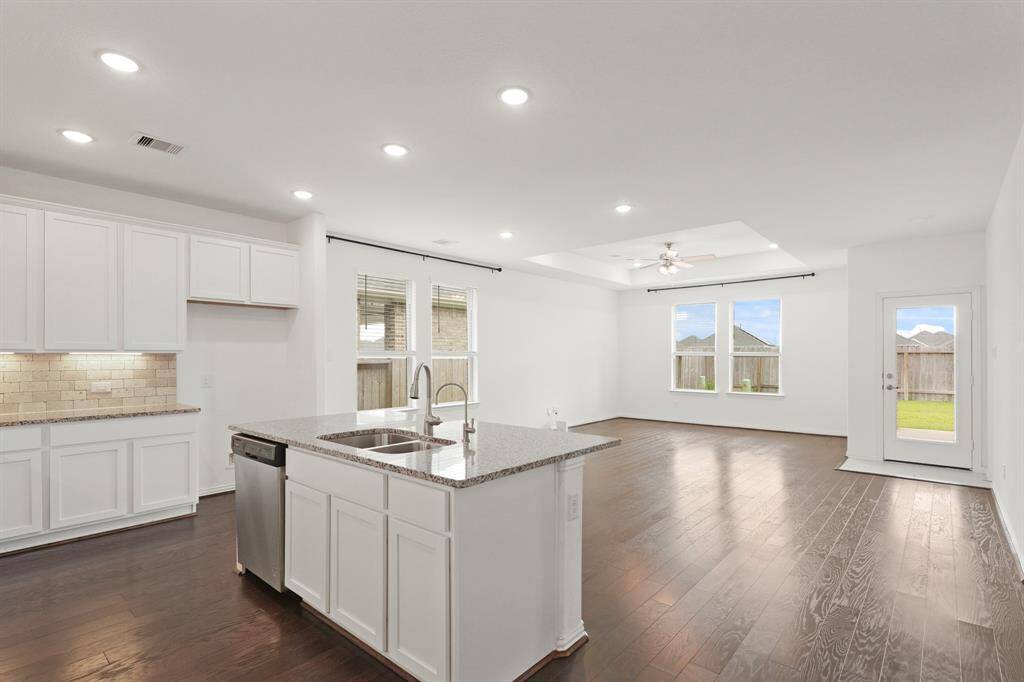 An open-concept Kitchen and Family Room design enhances togetherness and allows for easy conversation and multitasking.