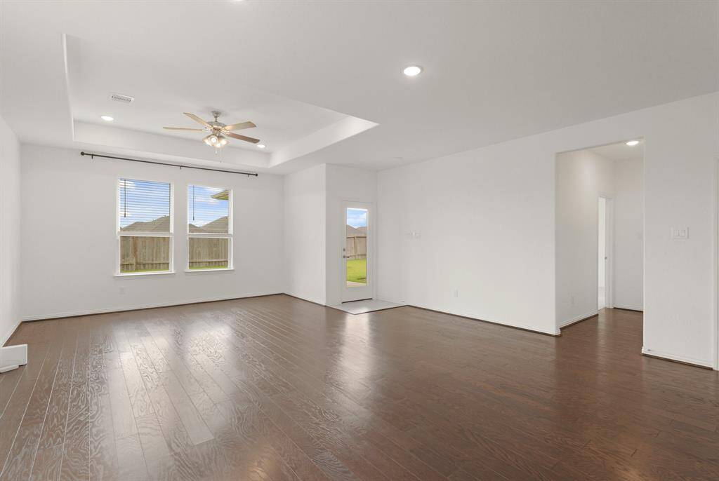 The warm and welcoming Family Room is designed for comfort, featuring ample space to relax and gather.