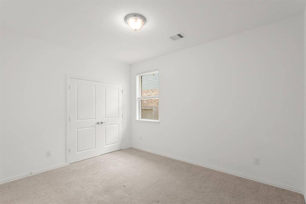 Light-filled Bedroom #2 features a spacious closet and neutral tones, ready for guests or everyday use.
