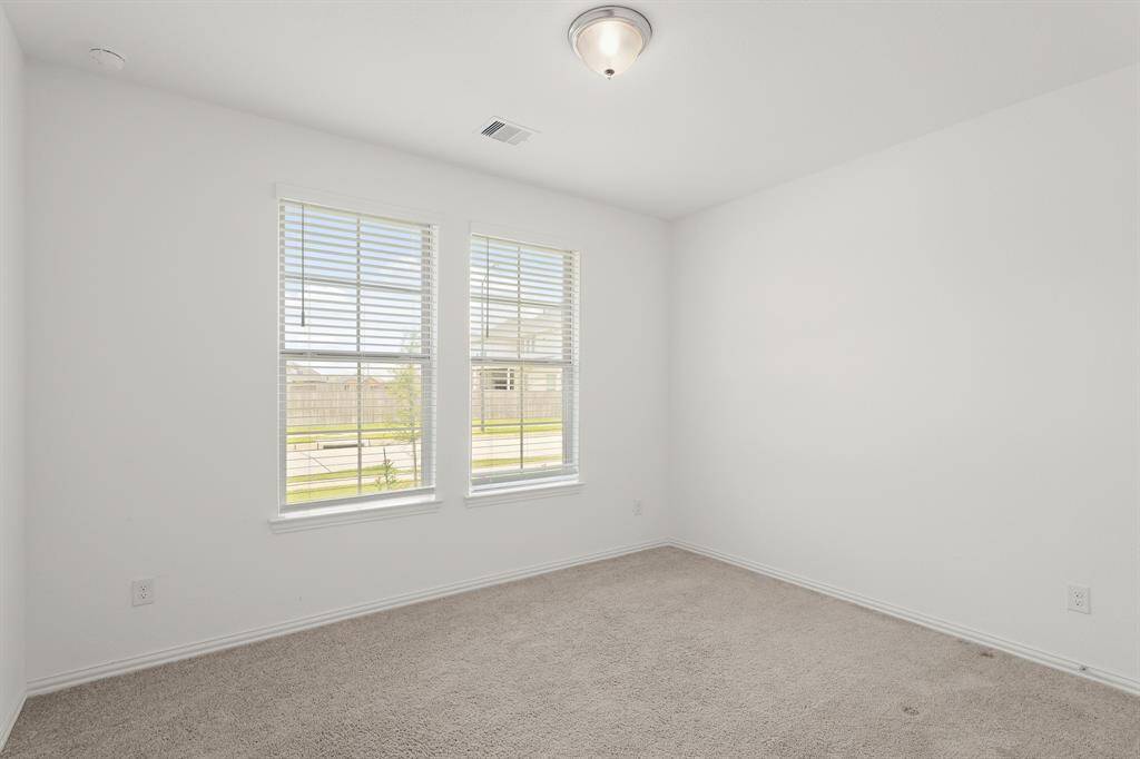 Bedroom #3 features soft natural light, neutral tones, and a comfortable layout suited for everyday living.