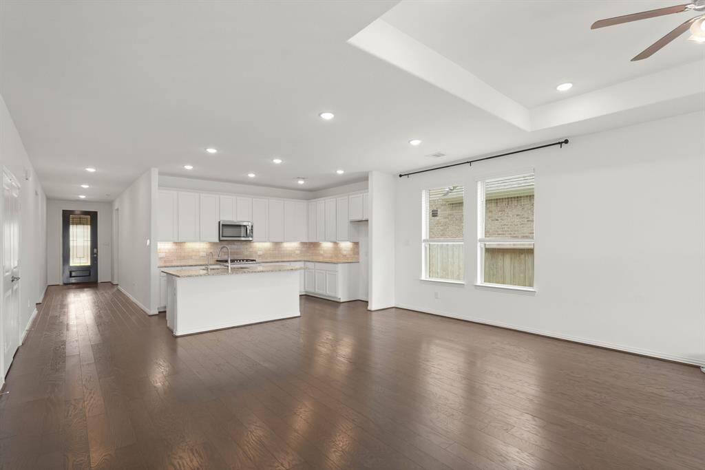 Bright and airy Entryway with a smooth transition into the Kitchen/main living areas, immediately feels like home.