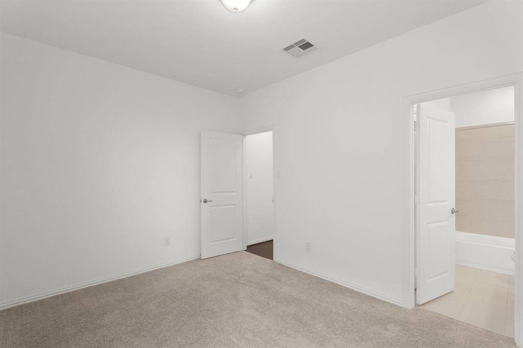 Bedroom #4 includes its own private bathroom, offering added convenience and a comfortable, self-contained space, ideal for a Guest Suite.