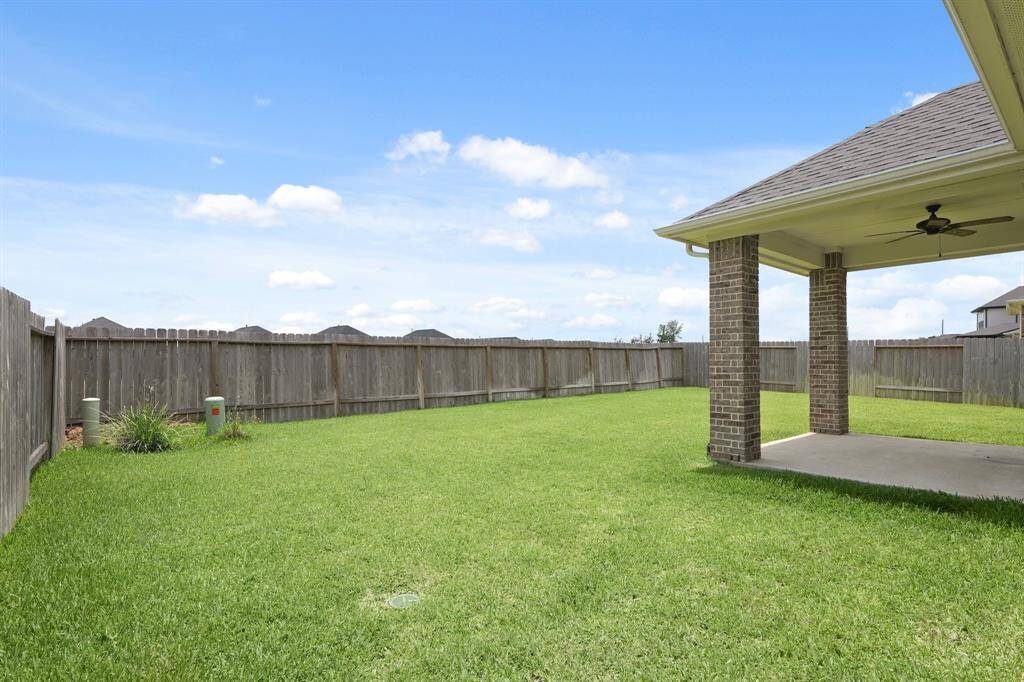 The fully fenced yard ensures privacy, while the covered patio offers a shaded retreat to relax and enjoy the view. French drain system in place to improve drainage and maintain the foundation’s integrity.