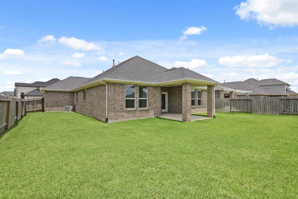 Enjoy outdoor living in this expansive backyard offering lots of space for a pool, playset and much more! An automatic six-zone sprinkler system keeps the entire yard lush and well-watered with minimal effort.