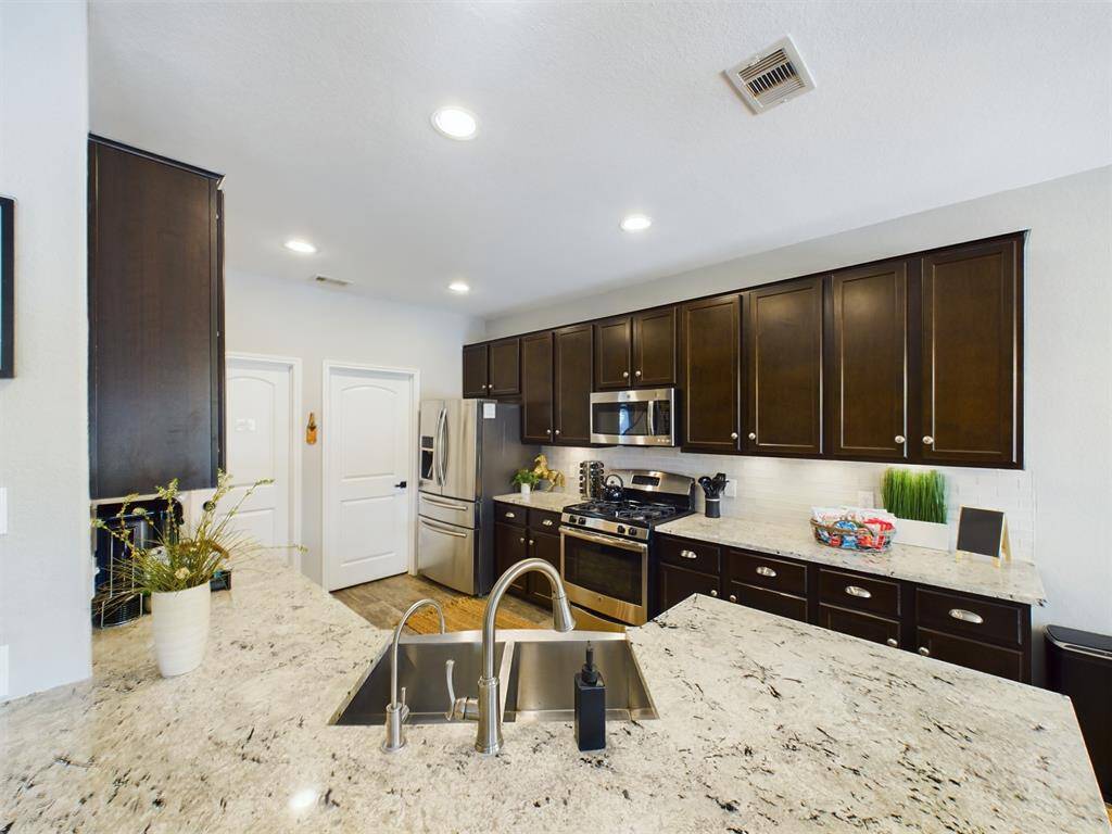 Full Size Utility Room and Walk-in Pantry off the Kitchen
