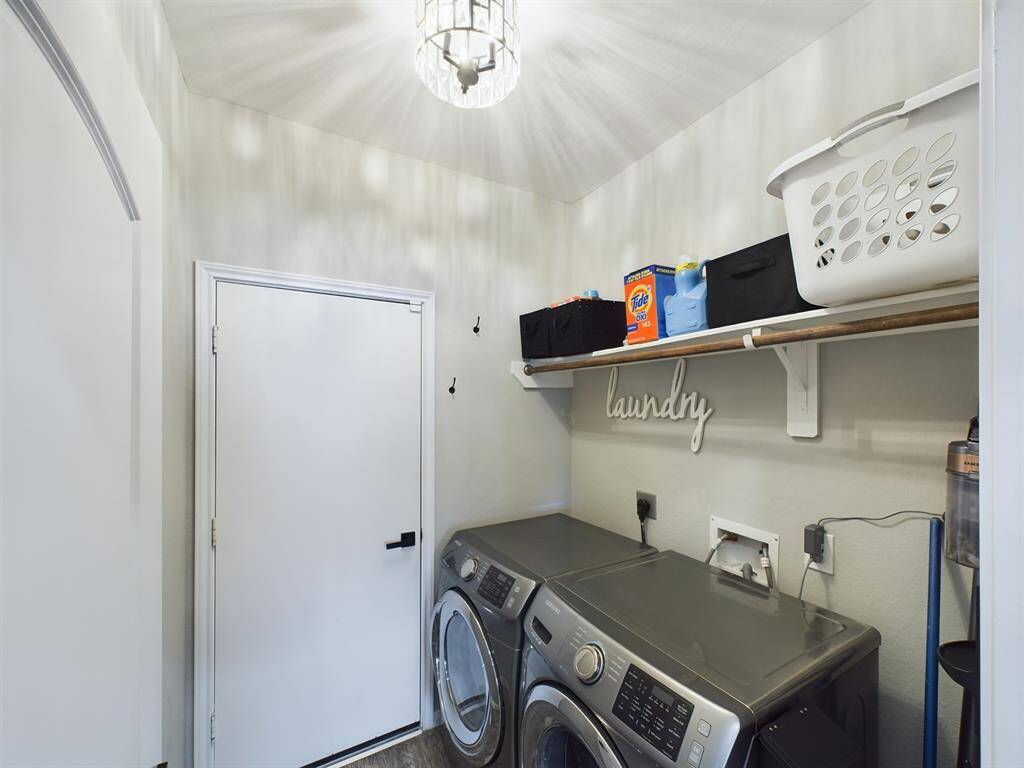 Full Sized Washer & Dryer w/Gas & Electric Connections. Also allows access to the 2-car garage.
