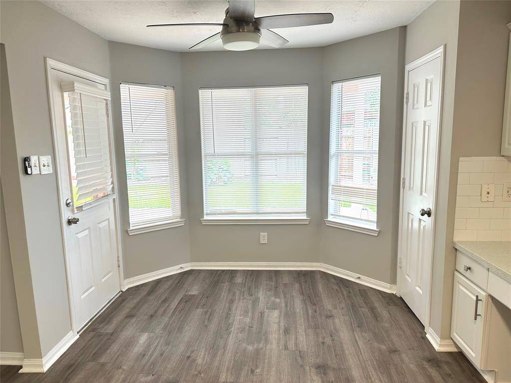 Bay window of the breakfast room offers a better view of the backyard.  Door on left exits to the covered patio.  Door on the right is the pantry.