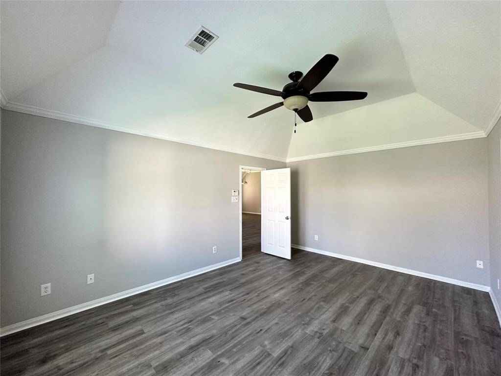 Soft gray paint on the walls complement the gray wood-look floors.