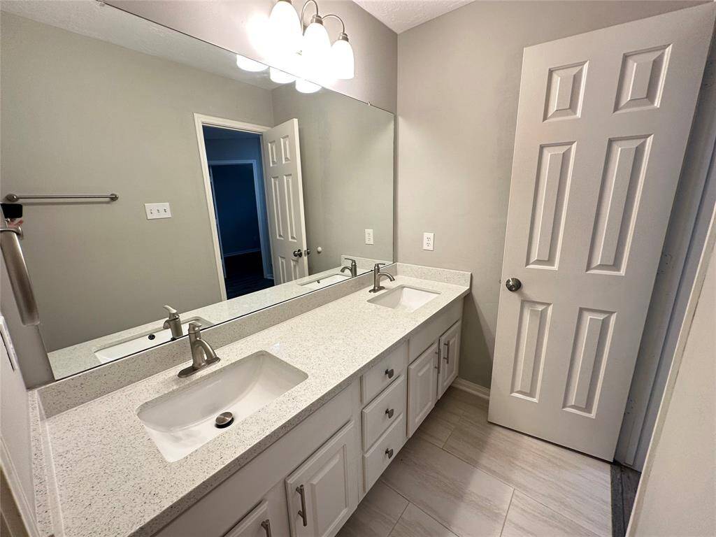 Hall bathroom has 2 sinks which is great to get everyone ready for the day (or bedtime). And best of all, there is another door separating the sinks from the toilet and shower area.