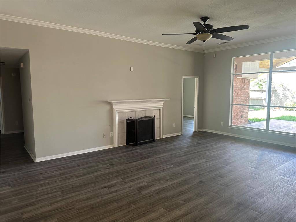 This den is laid out perfectly for an active lifestyle.  Primary bedroom is in the back (past the fireplace). All other bedrooms, laundry and the 2nd bathroom is upfront, to the left of the fireplace.