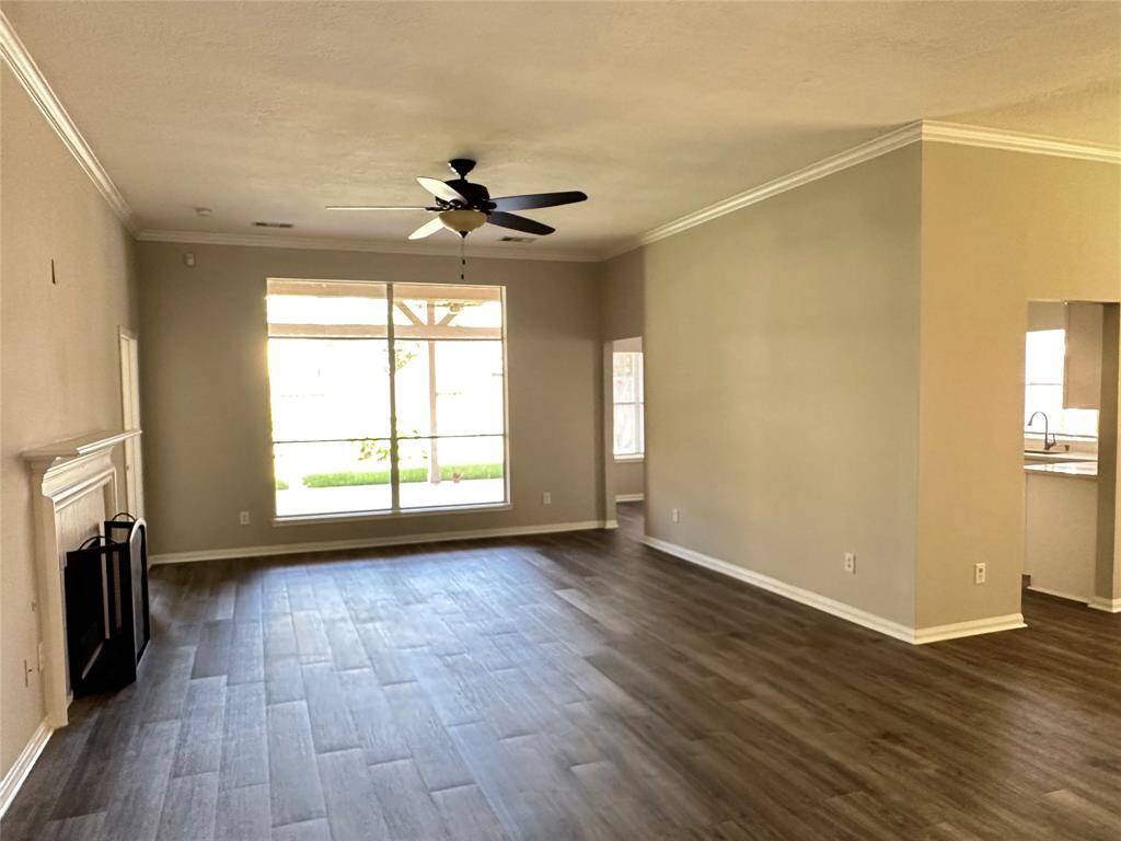 No carpet anywhere in the house, just these luxury vinyl planks for easy care and clean up.  By the way, the fireplace has gas logs for instant ambiance and a glowing fire.