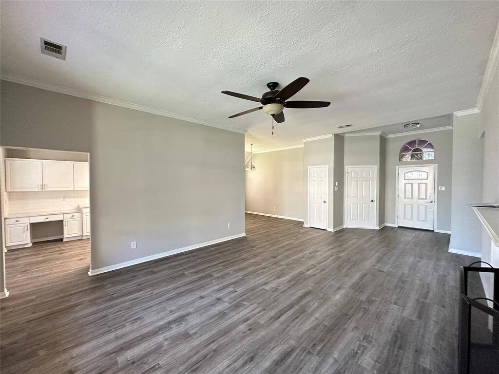 From this view you see the breakfast room and part of the kitchen on the left, formal dining room next to the coat closet and door to the attached garage.