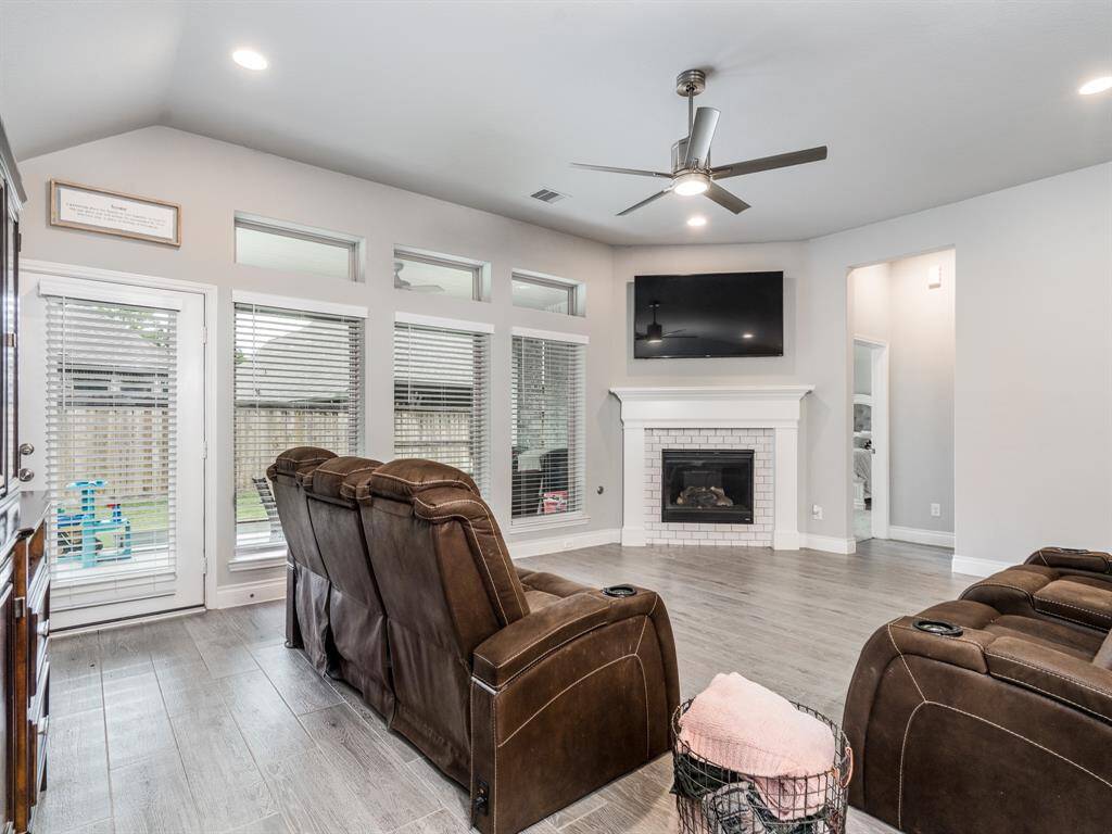 Living is anchored by a cozy fireplace.