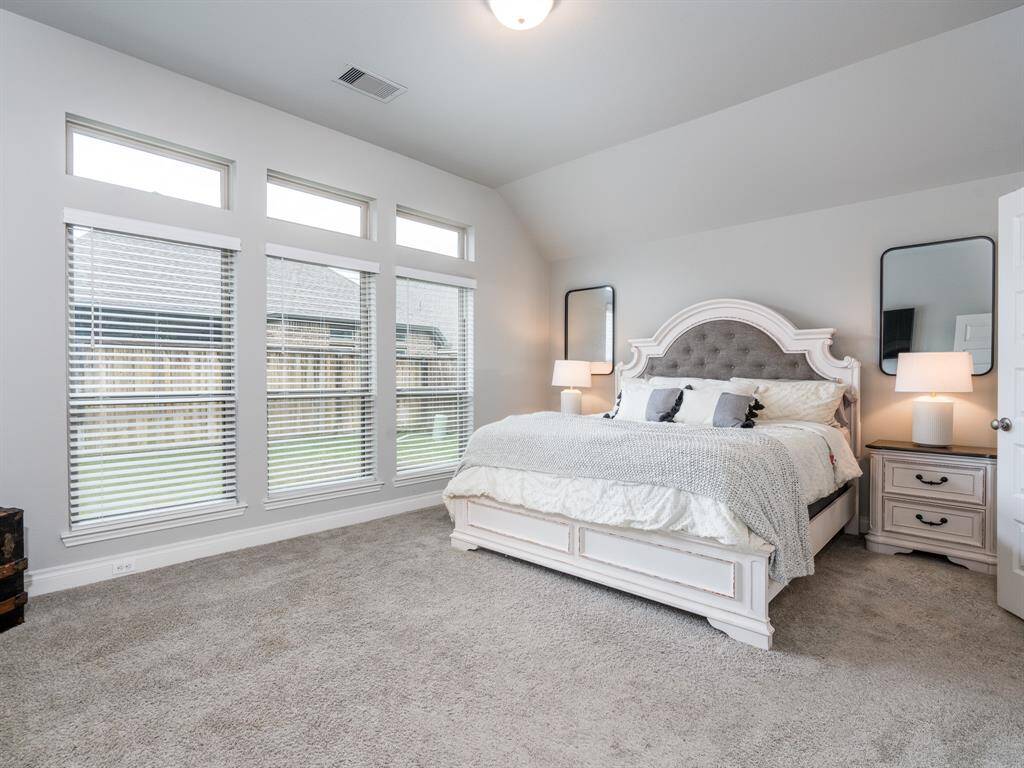 Primary suite is separated from other bedrooms.