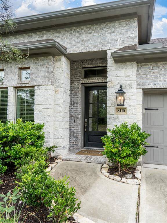 Upgraded elevation has brick and stone plus a covered front porch.