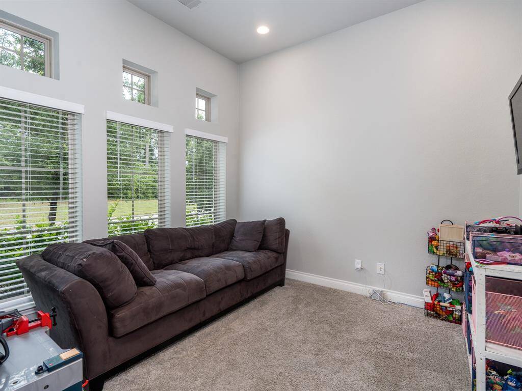 Bright study has French doors to keep this space quiet for calls.