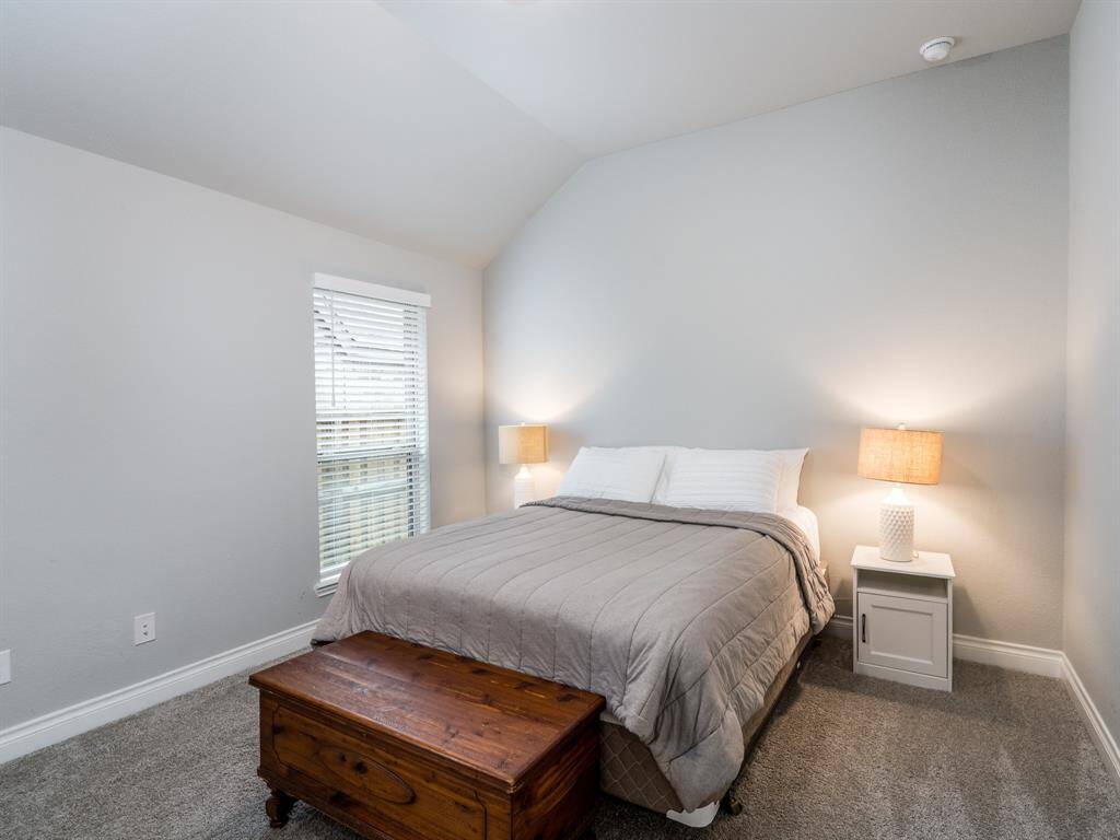 Hallway leads to the perfect guest suite with its own en suite full bath.