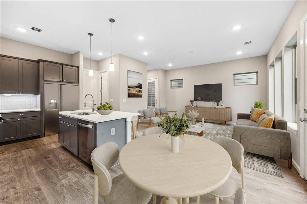 Sun-filled dining nook surrounded by windows—ideal for everyday meals or weekend brunches.