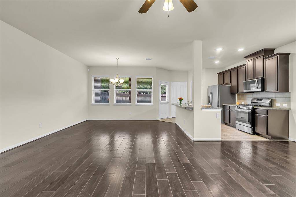 Enjoy a spacious living and dining area with an open kitchen, perfect for everyday living and entertaining.
