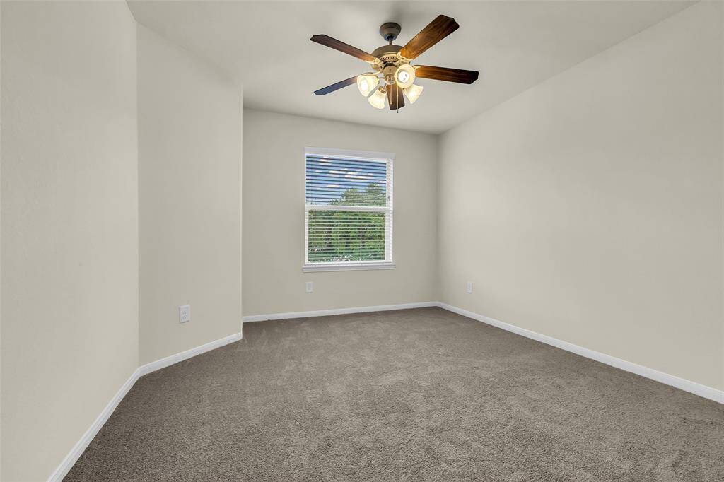 Generously sized bedroom featuring brand-new carpet