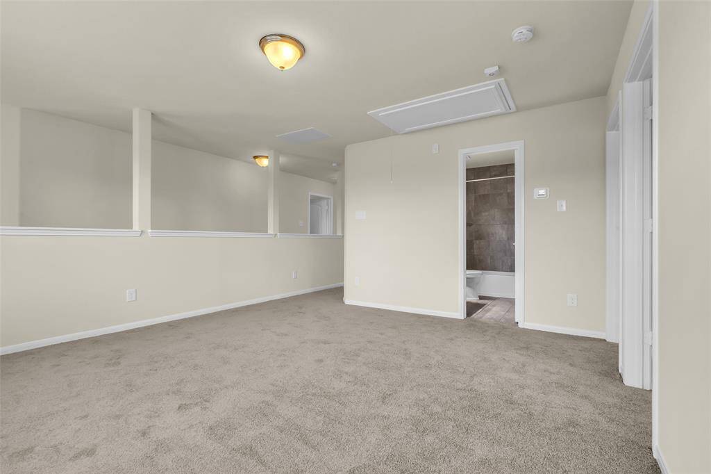 Upstairs features a spacious flex room or game room, open to two additional bedrooms and a full bathroom—all with brand-new carpet throughout.