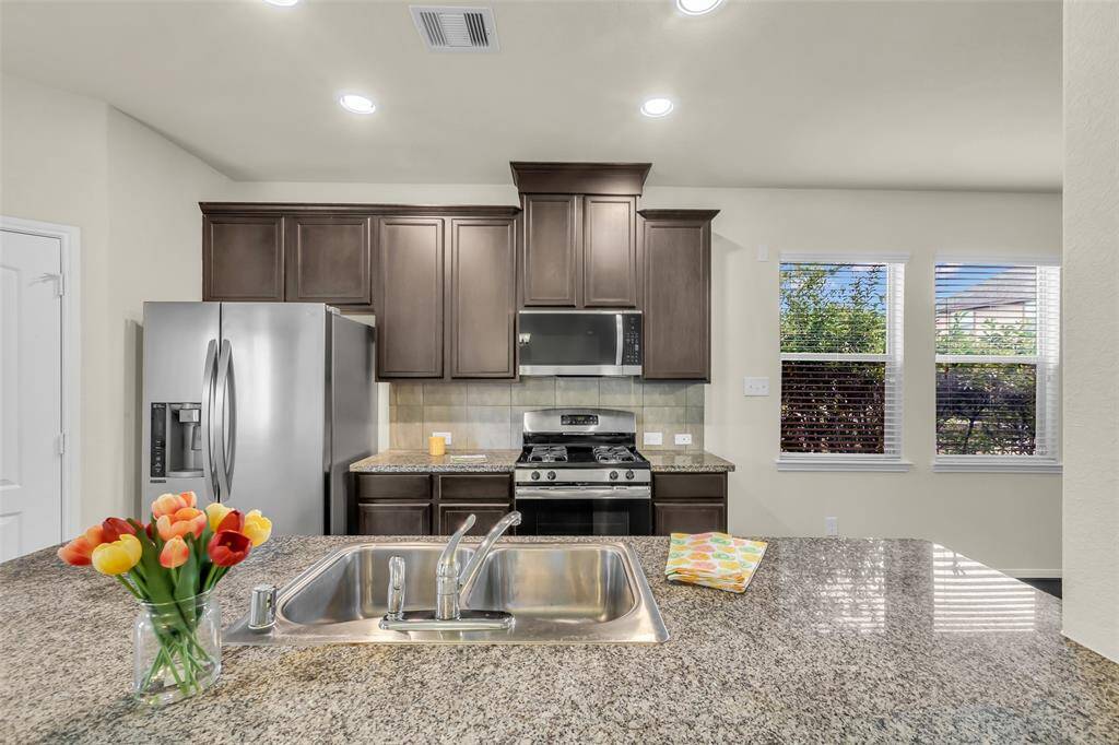 Beautiful kitchen that includes a refrigerator with your lease!