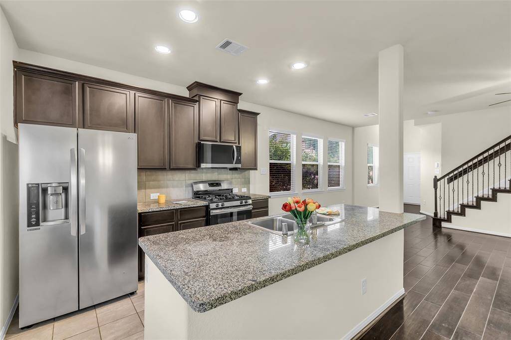 Generously sized kitchen ideal for all your cooking needs, seamlessly connected to an open-concept family room and dining area.