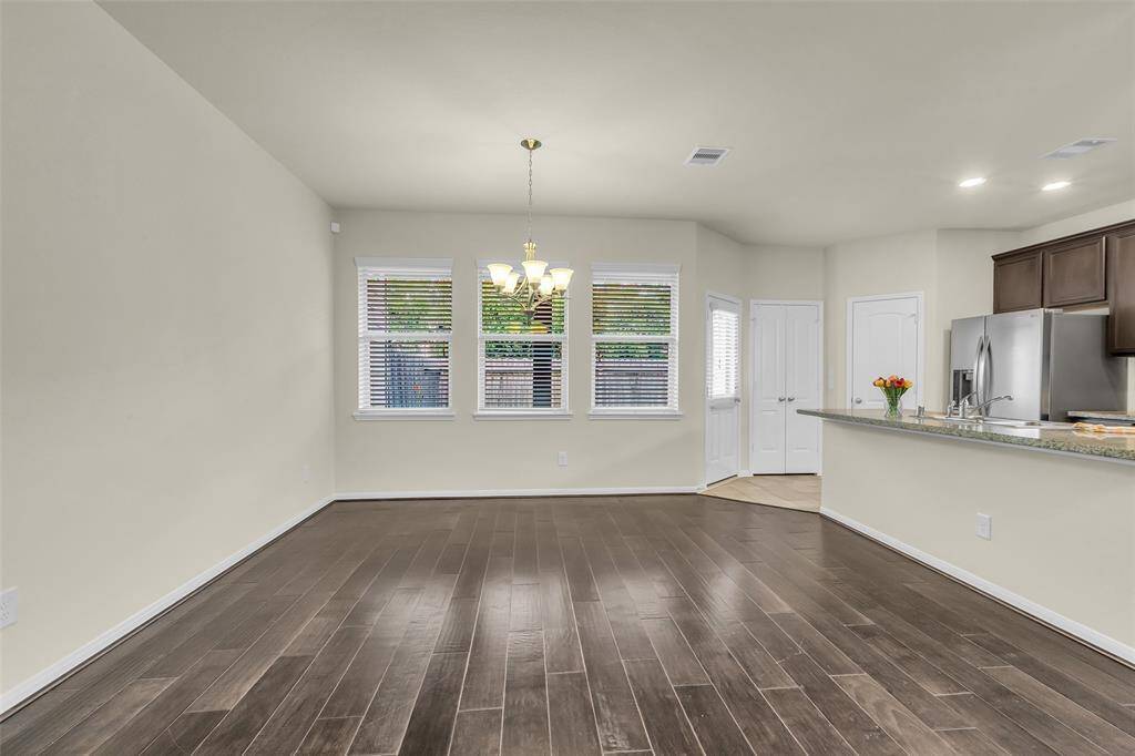 Generously sized kitchen ideal for all your cooking needs, seamlessly connected to an open-concept family room and dining area.