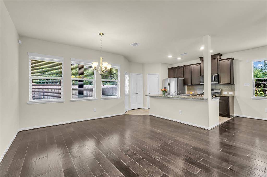 Enjoy a spacious living and dining area with an open kitchen, perfect for everyday living and entertaining.