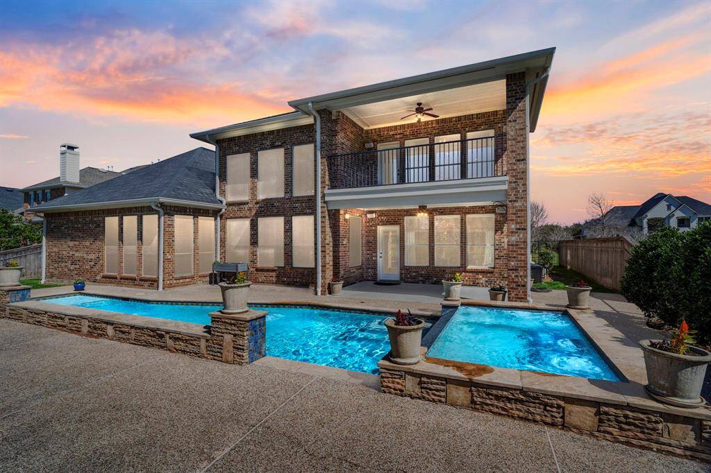 Step into the backyard oasis, with alarge covered patio, and balcony overlooking the pool and spa, creating aninviting outdoor retreat.