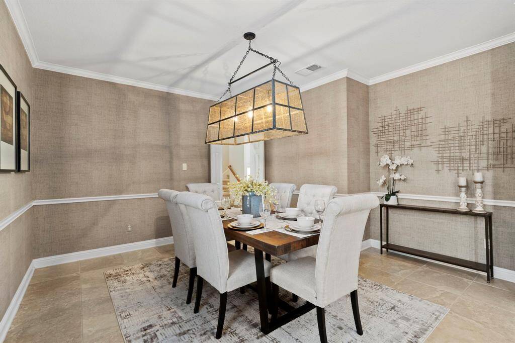 The dining room has plenty of lighting.