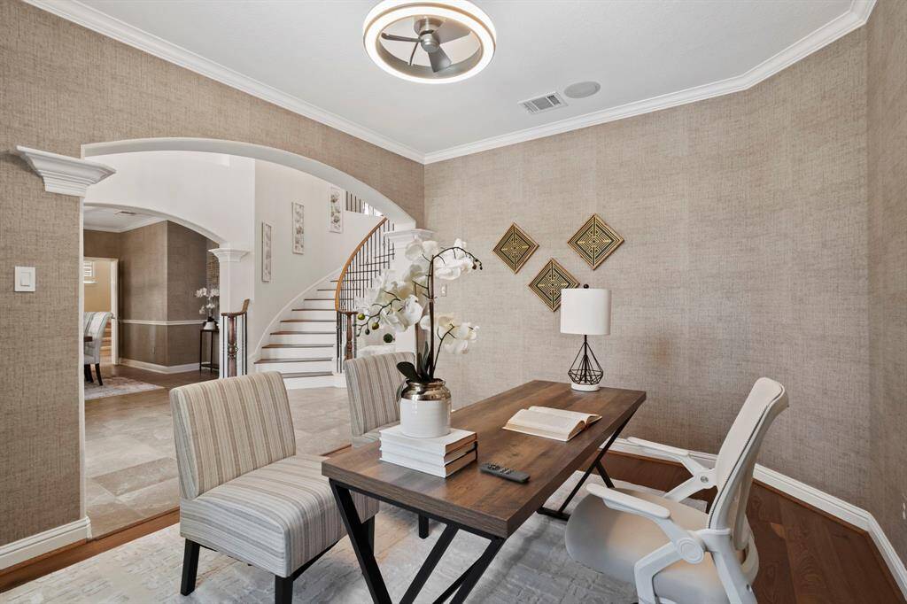 Across from the dining room is the den perfect for an office area.