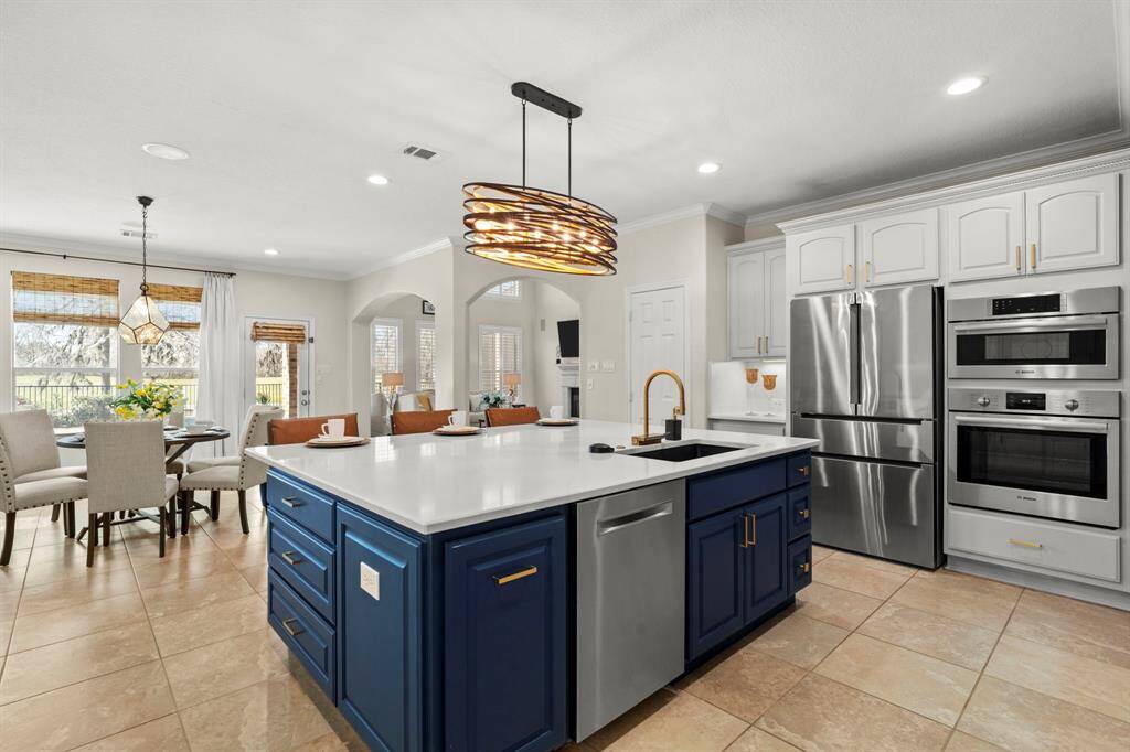 The kitchen, an integral part ofthis home's open-conceptdesign, seamlessly flows off theliving room, creating aharmonious and connectedliving space.