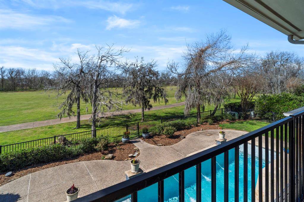 The balcony overlooks the backyard and golf course.