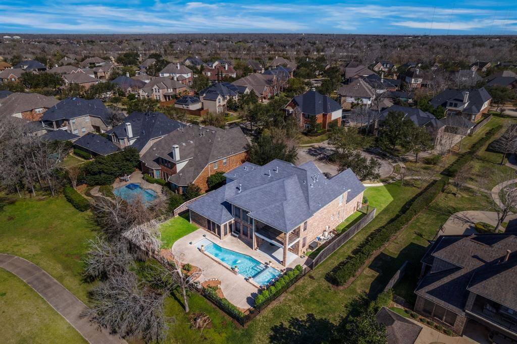 Step into the backyard oasis, with alarge covered patio, and balcony overlooking the pool and spa, creating aninviting outdoor retreat.